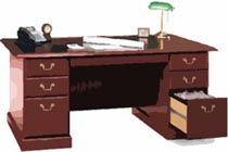 office desk with paperwork, a lamp, and a telephone on the desk