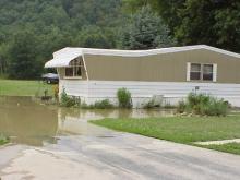 Mobile home flooded in the water